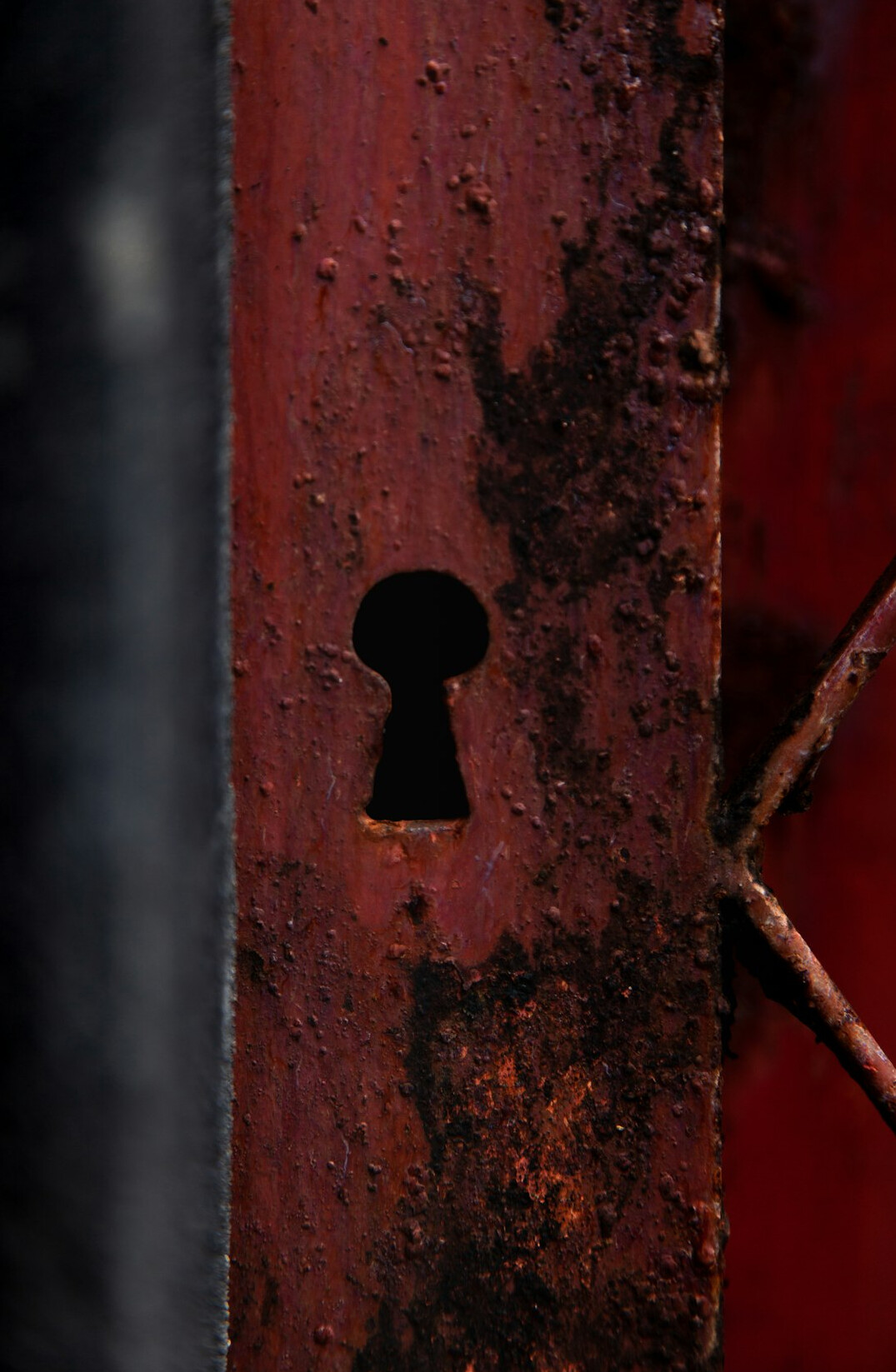 Close-up of an old rusted brass door lock and key